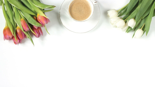 cup of coffee and tulip bouquets.