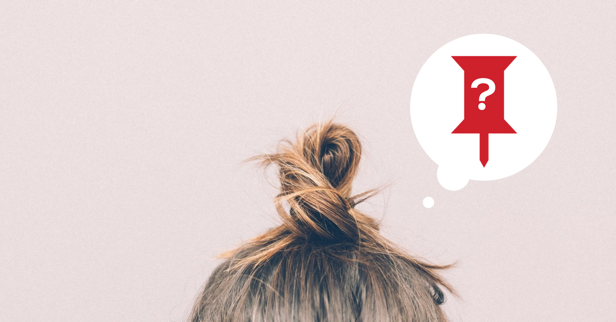 Person with a messy bun and talking bubble with pin and question mark in the pin.