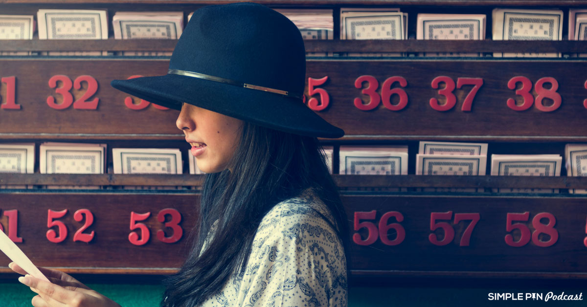 image of woman wearing a hat with numbers in background.