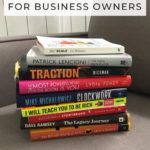 stack of business books on a sofa with text overlay "The Best Business Books"