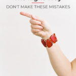 woman's hand pointing with text overlay "Pinterest marketing the right way: don't make these mistakes"
