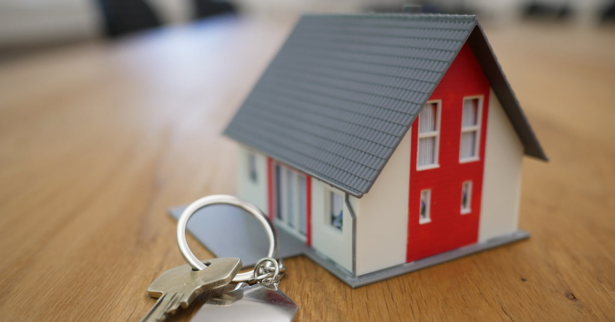 miniature house and house key.