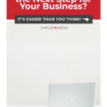 Macbook laptop on white desk with text overlay "Is Product Creation the Next Step in Your Business?"