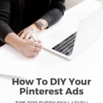 woman sitting at desk writing - text overlay "How to DIY your Pinterest Ads, Tips for every skill level! Listen in now".
