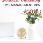 desk with clock, laptop and flowers - text "Pinterest Marketing Time Management Tips".