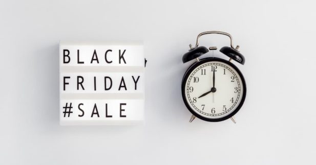 alarm clock with "Black Friday Sale" typography sign.