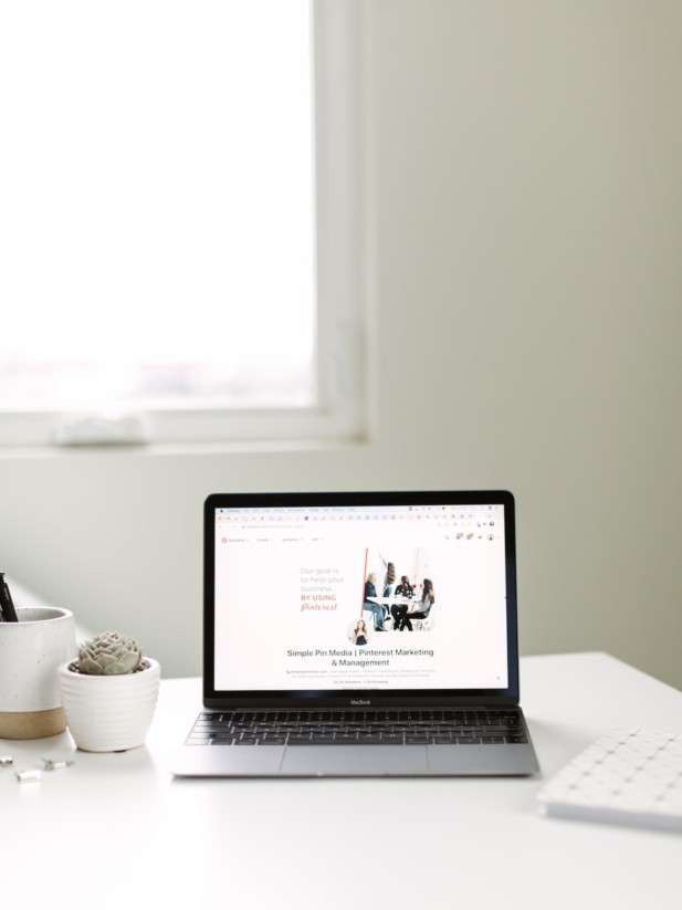 Pinterest marketing laptop on desk.