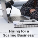 person with arms crossed sitting in front of laptop with text "hiring for a scaling business: how to do it well".