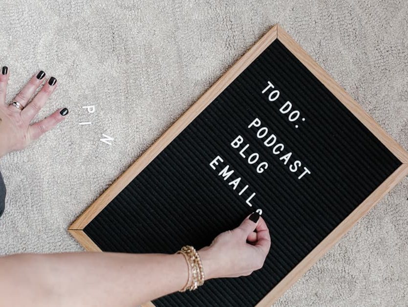 woman making words on a letter board.