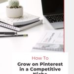 laptop on desk with text "how to grow on pinterest in a competitive niche".