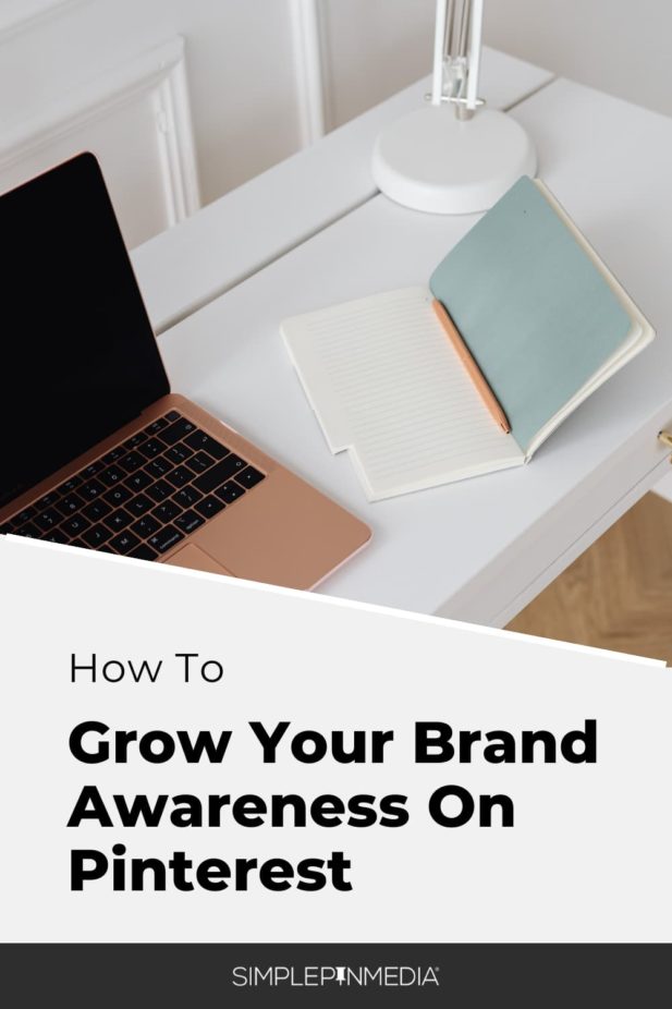 laptop on desk with text "how to grow your brand awareness on pinterest".