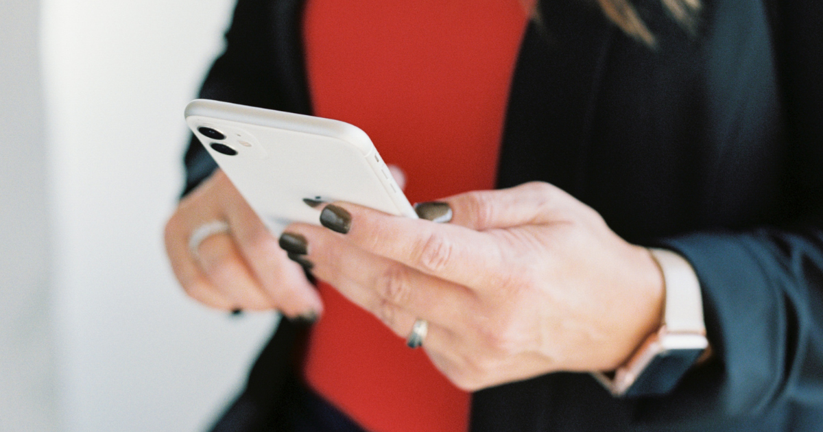 person holding white iphone.