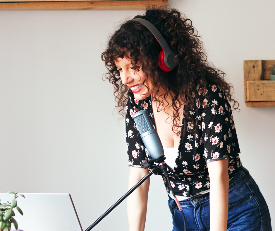 Woman speaking into a microphone.