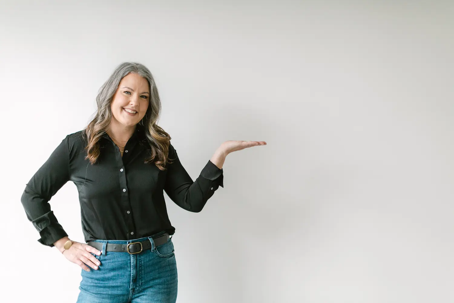 Kate, of Simple Pin Media, holding hand out.