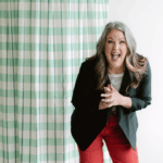 Image shows a woman laughing.