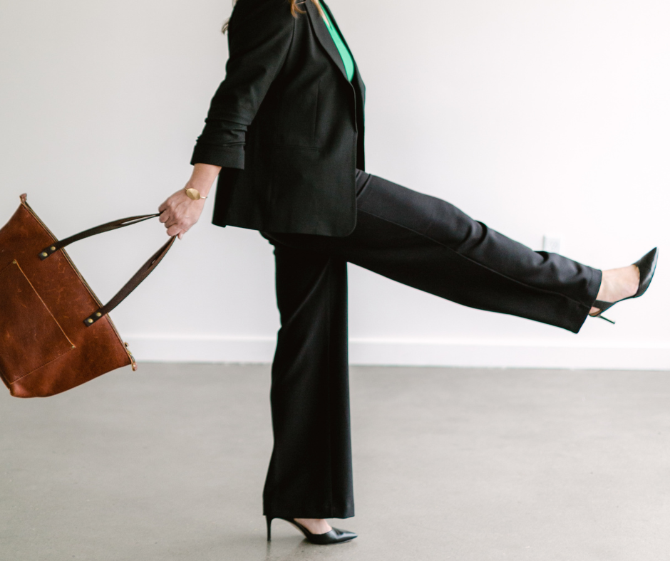 Image shows a woman swinging a purse.