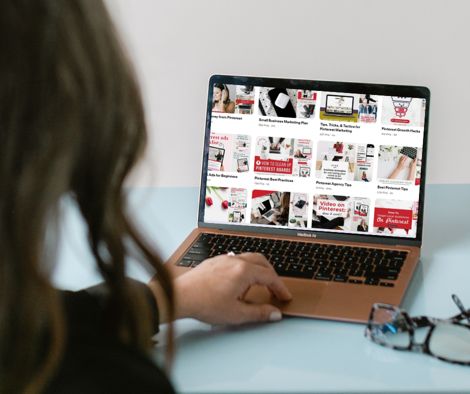 Image shows a woman looking at a laptop screen.