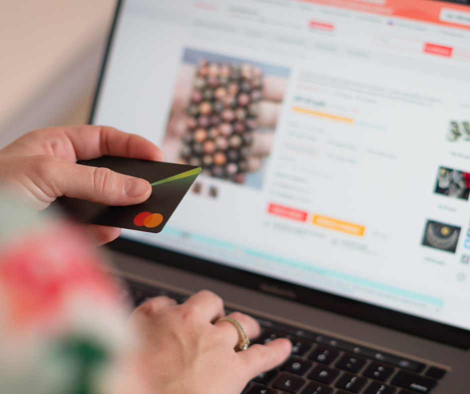 Image shows a credit card over a computer screen