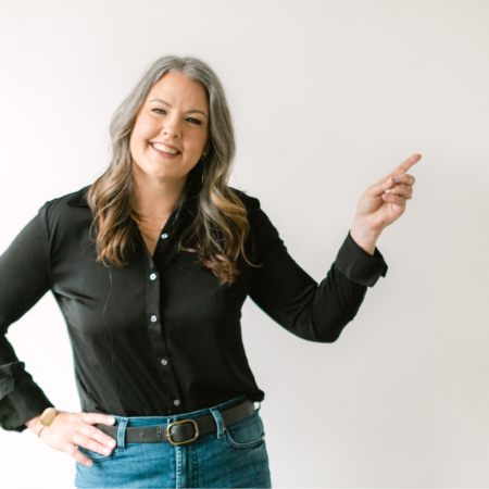 Image shows a woman pointing.